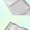A white plastic drawer organizer tray with two compartments shown from an angled view.