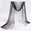 Sheer black and white fabric playsilk draped like a curtain for imaginative play