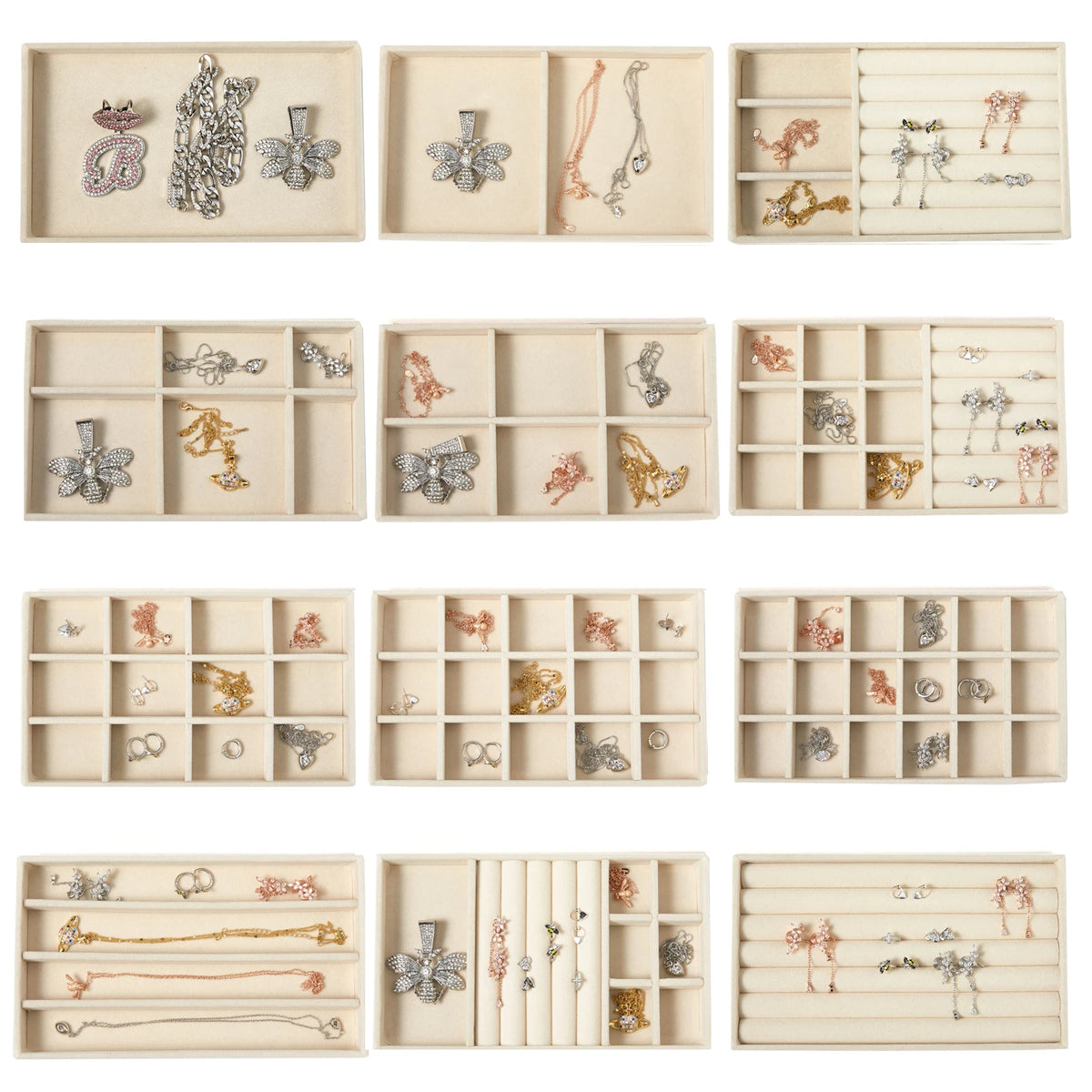 A collection of velvet jewelry organizer trays with various compartments and decorative dividers.