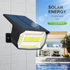 A black solar panel with 72 LED beads is mounted on a wall, illuminating an outdoor area.