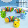 A multi color option articulated fidget slug toy with three colors visible in various arrangements.