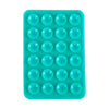 A teal silicone suction cup phone mount with multiple circular holes for hands-free viewing.