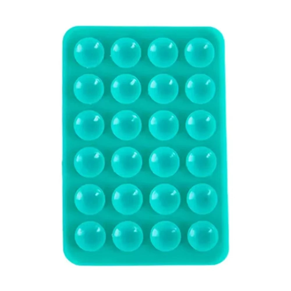 A teal silicone suction cup phone mount with multiple circular holes for hands-free viewing.