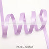 A roll of light purple satin ribbon used for crafting or gift wrapping.