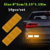 Ten reflective yellow safety strips for car visibility shown next to a dark vehicle.