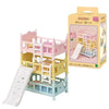 A boxed set of Sylvanian Families Forest Friends featuring a pink crib and yellow accessories for a baby bed.