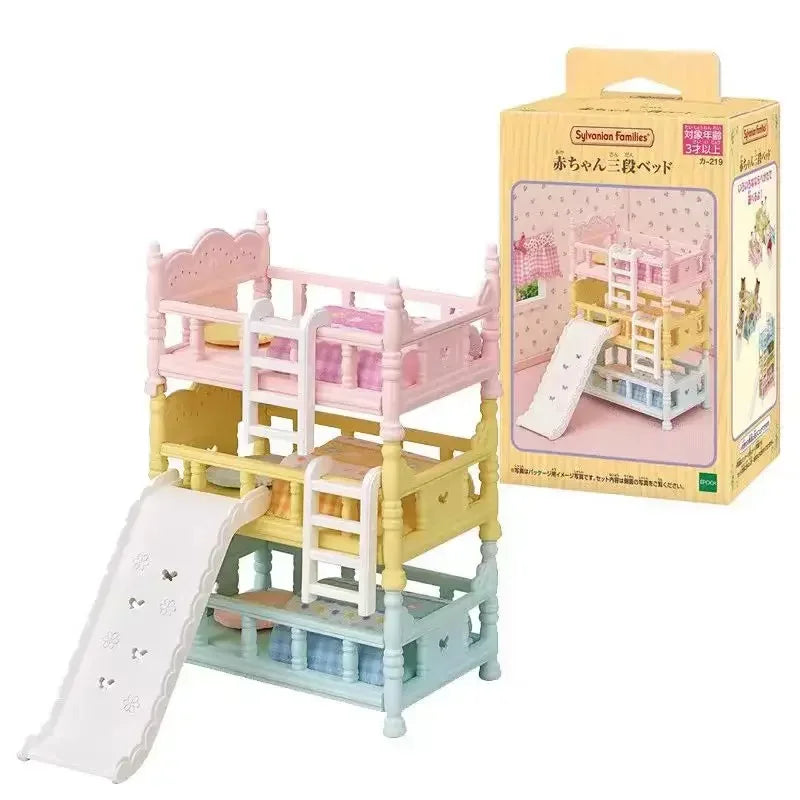 A boxed set of Sylvanian Families Forest Friends featuring a pink crib and yellow accessories for a baby bed.