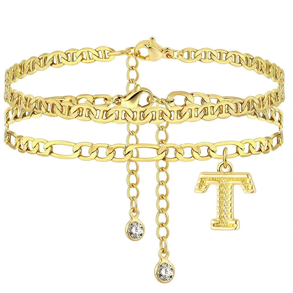 Gold stainless steel initial anklet featuring a chain bracelet and a letter T charm.