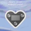 A heart-shaped ambient light fixture designed for installation without a plug, shown near a car.