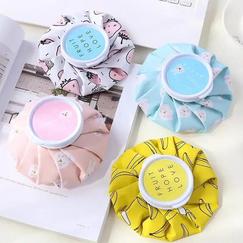 A collection of reusable multi-use ice and heat therapy packs in pink, blue, and yellow colors.