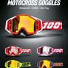 A display of professional motocross goggles in various colors, including red, pink, and yellow, highlighting windproof and an
