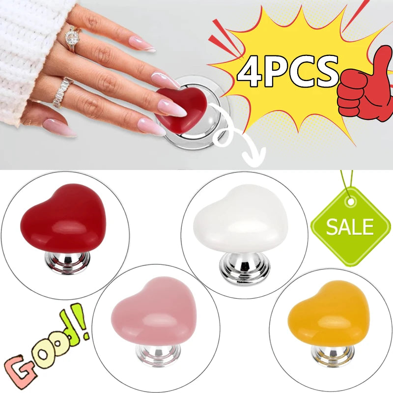 Four heart-shaped toilet flush buttons in red, white, pink, and yellow colors shown with a hand.