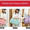 Three methods of displaying a large capacity travel duffel bag: single shoulder, crossbody, and portable.