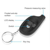 A black digital tire pressure gauge with a measuring valve, LCD display, switch, and key ring attached.