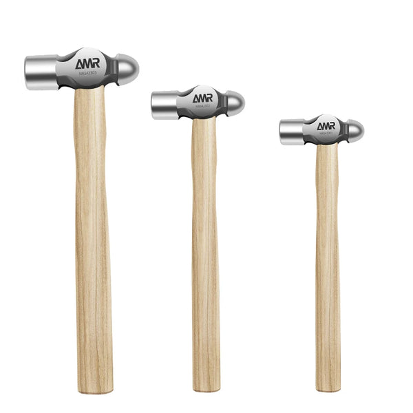 A set of three ball peen hammers featuring walnut wood handles and high-carbon steel heads.