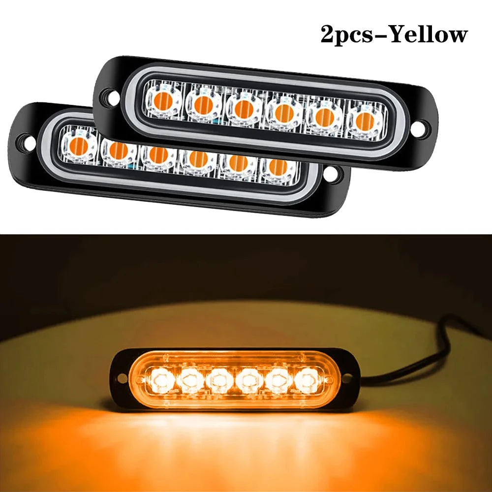 Two yellow LED strobe side marker lights are shown, with one light illuminated and casting an orange glow.