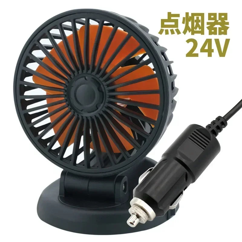 A black 24V point light fan with an orange blade and a power cord.