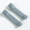 A pair of gray silicone bicycle brake lever covers, shown diagonally against a white background.