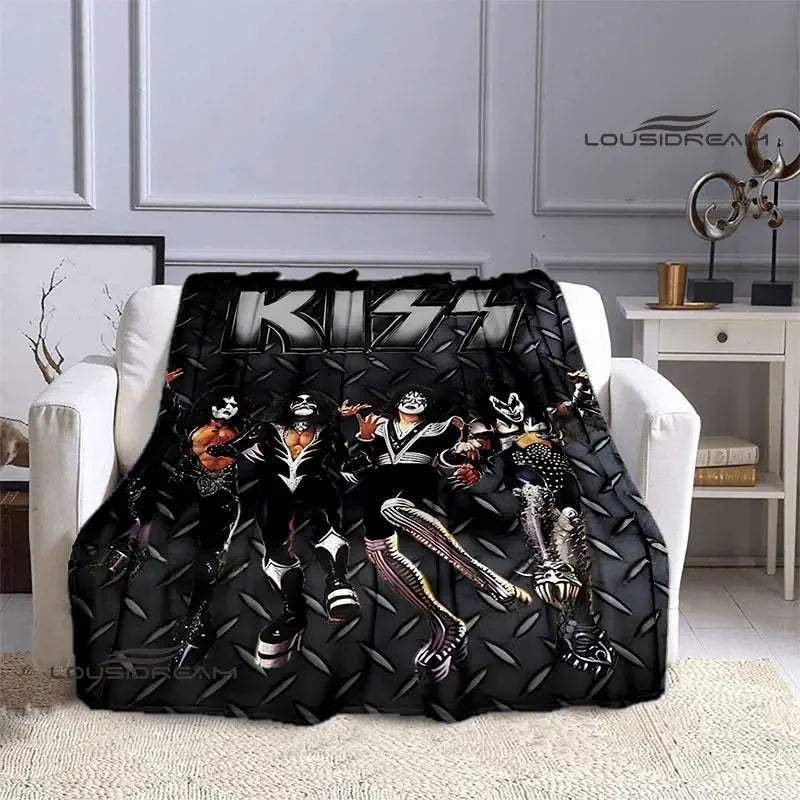 Black flannel throw blanket featuring a graphic print of the Kiss band members.