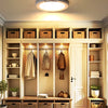 A modern wooden cabinet display featuring an LED motion sensor ceiling light.
