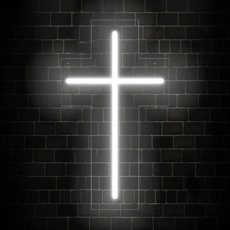 A bright white neon cross illuminated on a dark brick wall.