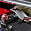 Close-up of an aluminum JDM fender washer and bolt kit assembly with red and silver components.