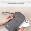 A gray RFID-blocking passport holder is shown being used to store a white smartphone.