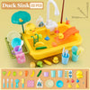 A yellow kids electric kitchen sink playset with running water, various food items, and fishing toys.