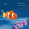 An orange and white plastic swimming fish toy is shown floating in blue water.