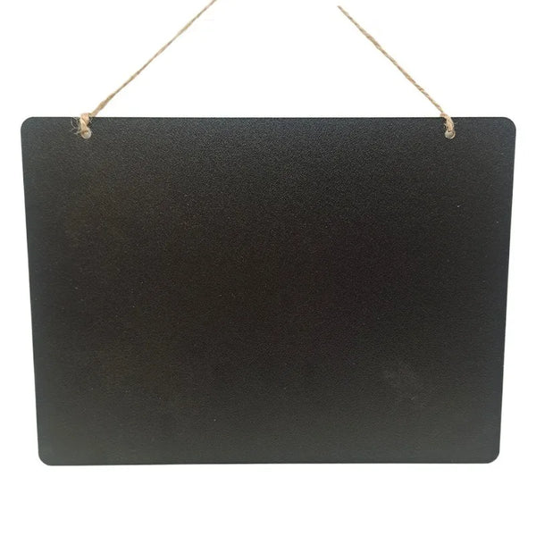 A rectangular black chalkboard sign with twine hanging from the top.