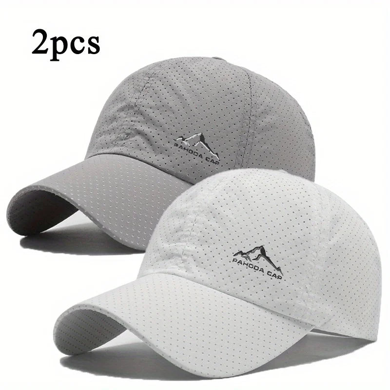 A set of two light gray and white quick dry baseball caps shown against a white background.
