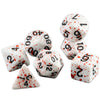 A set of seven polyhedral dice, including a d10 and d20, with white and red markings.