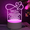 A glowing acrylic night light shaped like a heart with text reading Dear Mom and loving messages.