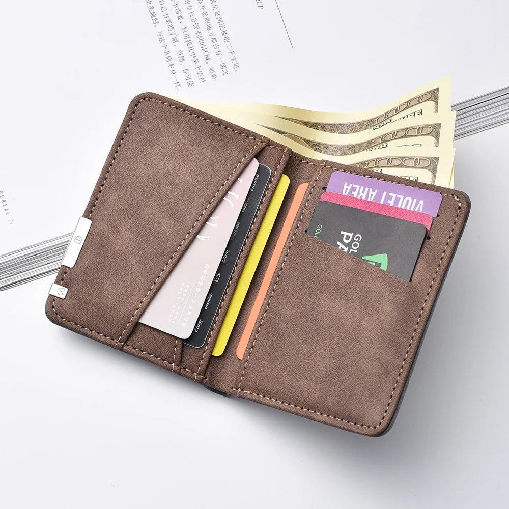 A brown men's compact double-fold wallet with multiple card slots resting on a white surface next to some currency.