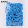 A plastic bag containing 100 pieces of blue disposable transparent waterproof shower caps.
