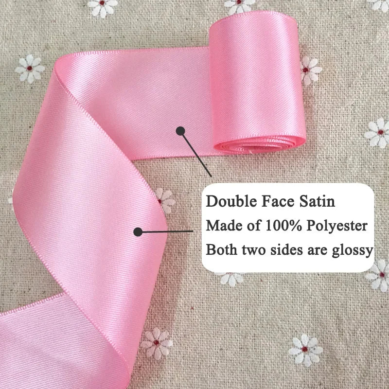 Pink double face satin ribbon made of 100% polyester with glossy sides