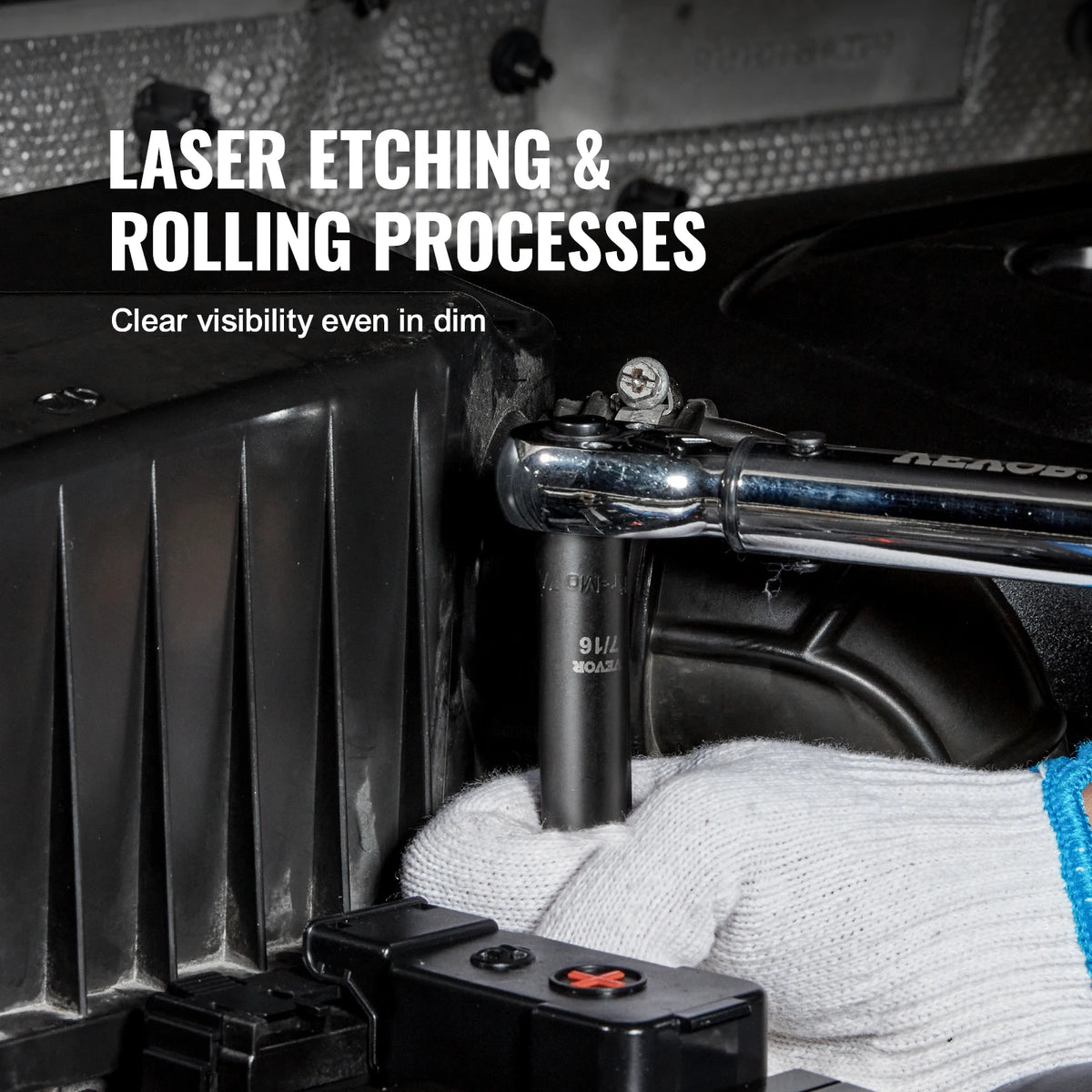 A hand wearing a white glove is holding a chrome impact socket set near a black automotive component for laser etching and ro
