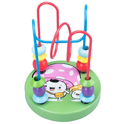 A wooden bead maze toy with red and blue handles and colorful beads on a green base for toddlers.