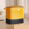 A yellow and black waterproof heavy-duty storage bag standing on a wooden floor.