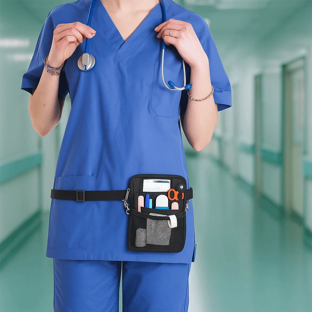 A nurse wearing blue scrubs holds a multi-pocket crossbody fanny pack with various medical tools.