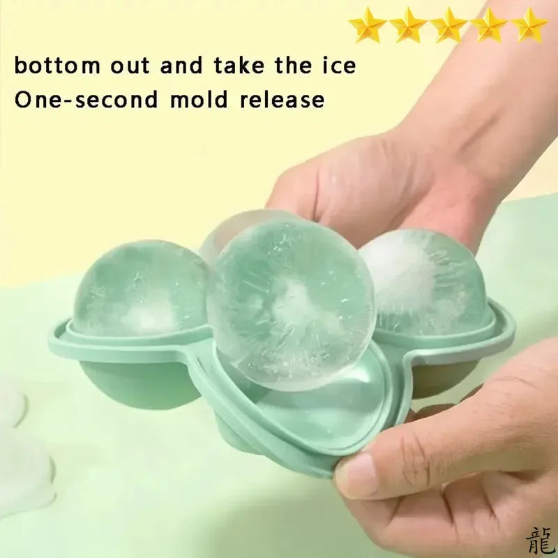 A hand holds a green silicone ice cube tray with three molded ice cubes, demonstrating the one-second mold release feature.