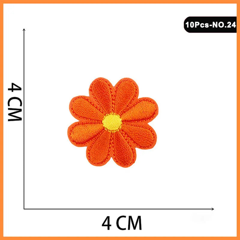 Orange embroidered iron-on patch shaped like a flower or rose with a yellow center