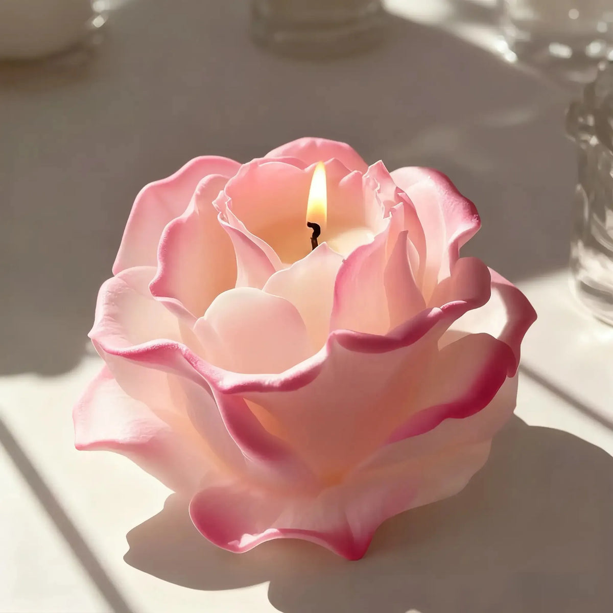A pink rose-shaped silicone mold for crafting candles, soap, and resin