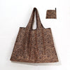 A brown leopard print reusable shopping tote bag with a matching fabric carry pouch.