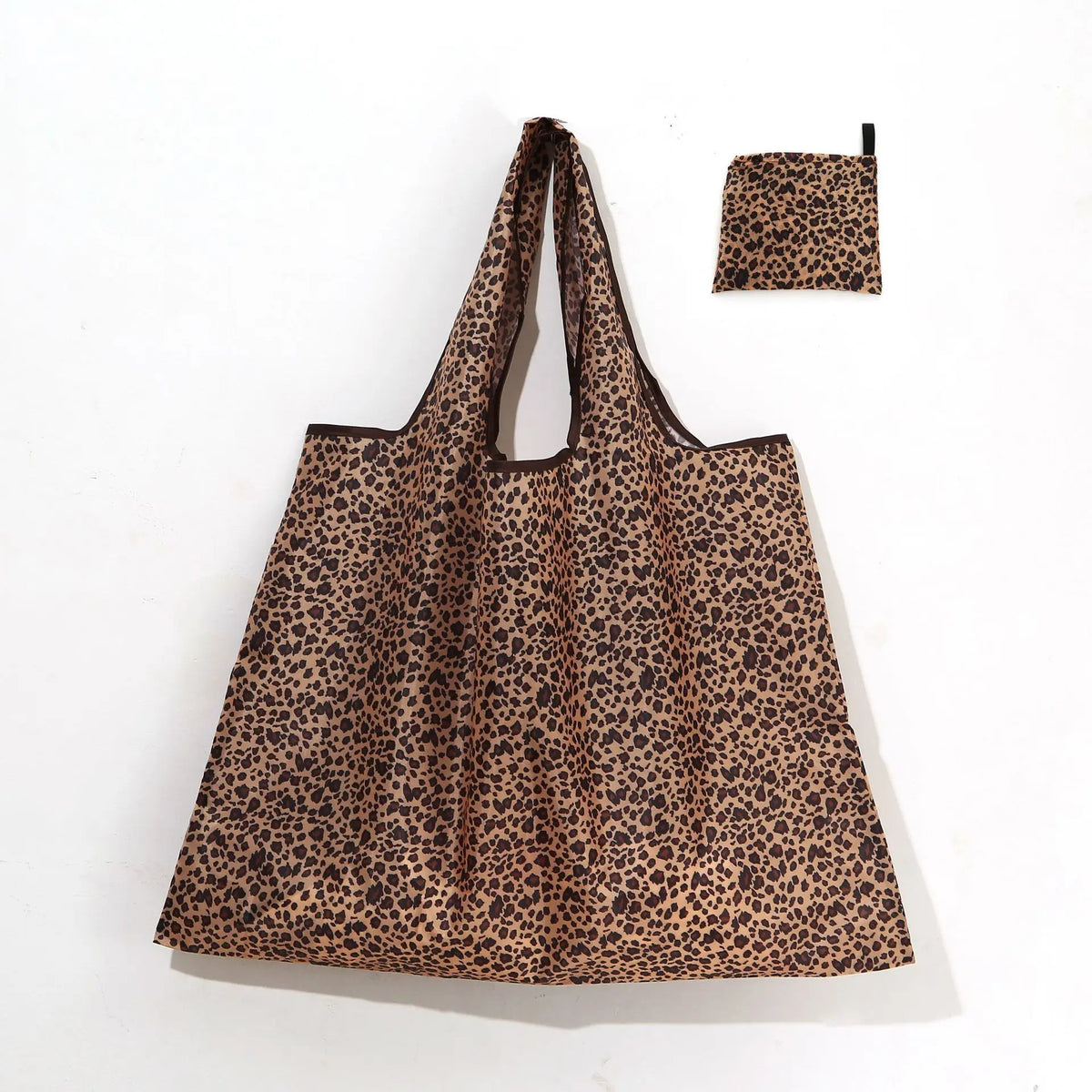 A brown leopard print reusable shopping tote bag with a matching fabric carry pouch.