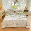A white comforter with a panda print pattern is displayed on a bed, surrounded by light curtains and decorative pillows.