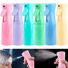 A set of five colorful refillable mist spray bottles for hair, skin, and home use shown in various shades.