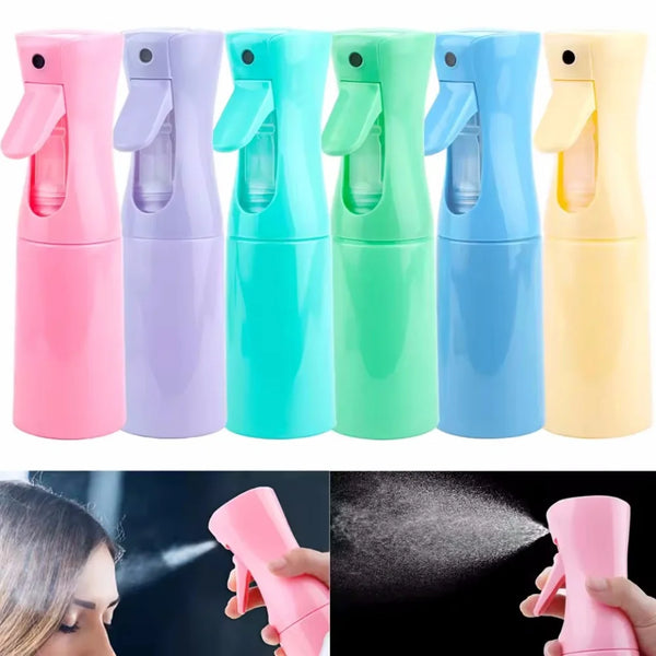 A set of five colorful refillable mist spray bottles for hair, skin, and home use shown in various shades.