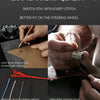 Close-up of hands crafting a leather steering wheel cover with sewing threads and stitching.