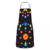 A black apron decorated with colorful Mexican floral art patterns.